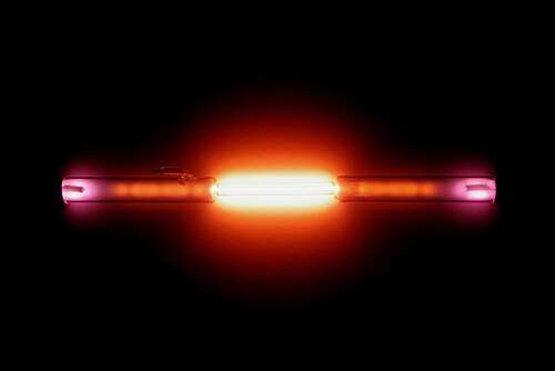 A clear tube with a red light emanating from it