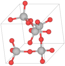 Unit cell of α-cristobalite; red spheres are oxygen atoms. We see here five silicon atoms in a helix (the first and the last are equivalent atoms in the lattice) going in the "c" direction (into the page). The horizontal and vertical axes are the "a" axes.