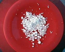 Sample of white powder and spherules