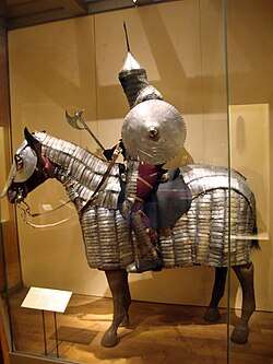 Statue of horse and rider in armour