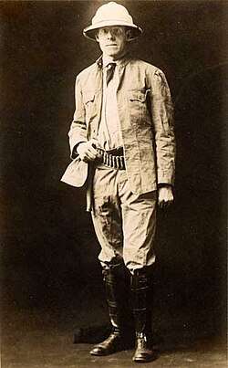 A man in safari gear in the early 1900s