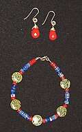 Necklace and earring set made from semiprecious stones. The spherical green beads are Russian serpentine. Also used are jasper (red) and fluorite (blue).