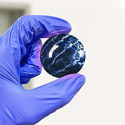 Sample of a spherically carved and polished fluorite via lapidary, a form commonly associated with decorative uses.