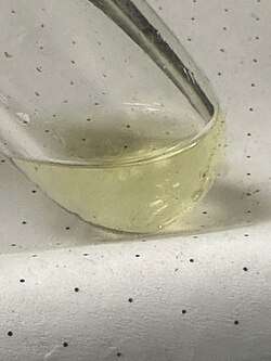 A sample of liquefied ketene (ethenone) at -60&nbsp;°C, yellow due to polymerization