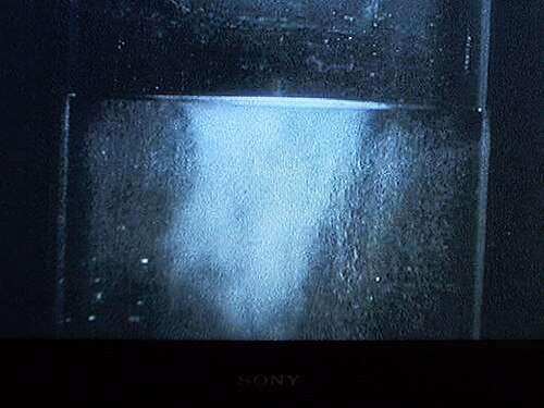 Liquid helium (in a vacuum bottle) at 4.2&nbsp;K (−268.95&nbsp;°C) and 1&nbsp;bar (15&nbsp;psi) boiling slowly.