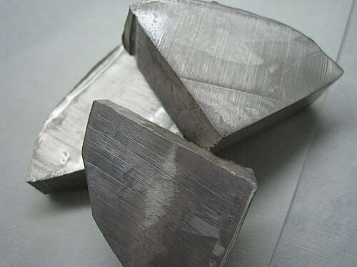 Three large pieces of silvery metal