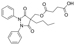 Two-dimensional monochrome diagram showing the structure of the molecule of Suxibuzone, uing the hexagonal style to depict a chemical compound.