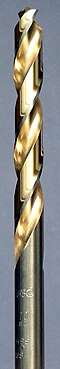 A steel colored twist drill bit with the spiral groove colored in a golden shade