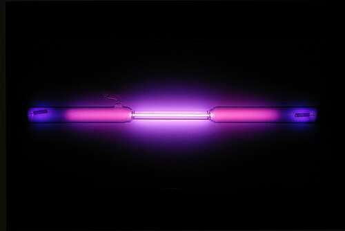 Vial containing a violet glowing gas