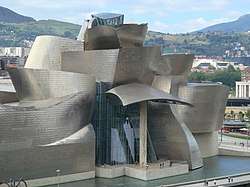 Building made of abstract shapes covered in silvery metal