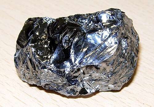 A lump of black reflective metal