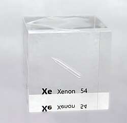 A partly filled ampoule containing a colorless liquid