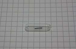 A small gold foil electroplated with technetium-99, sealed in an ampoule under an argon atmosphere.